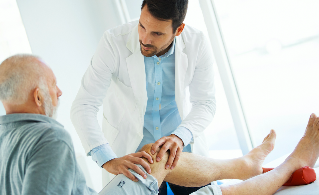 doctor checking patient with arthritis