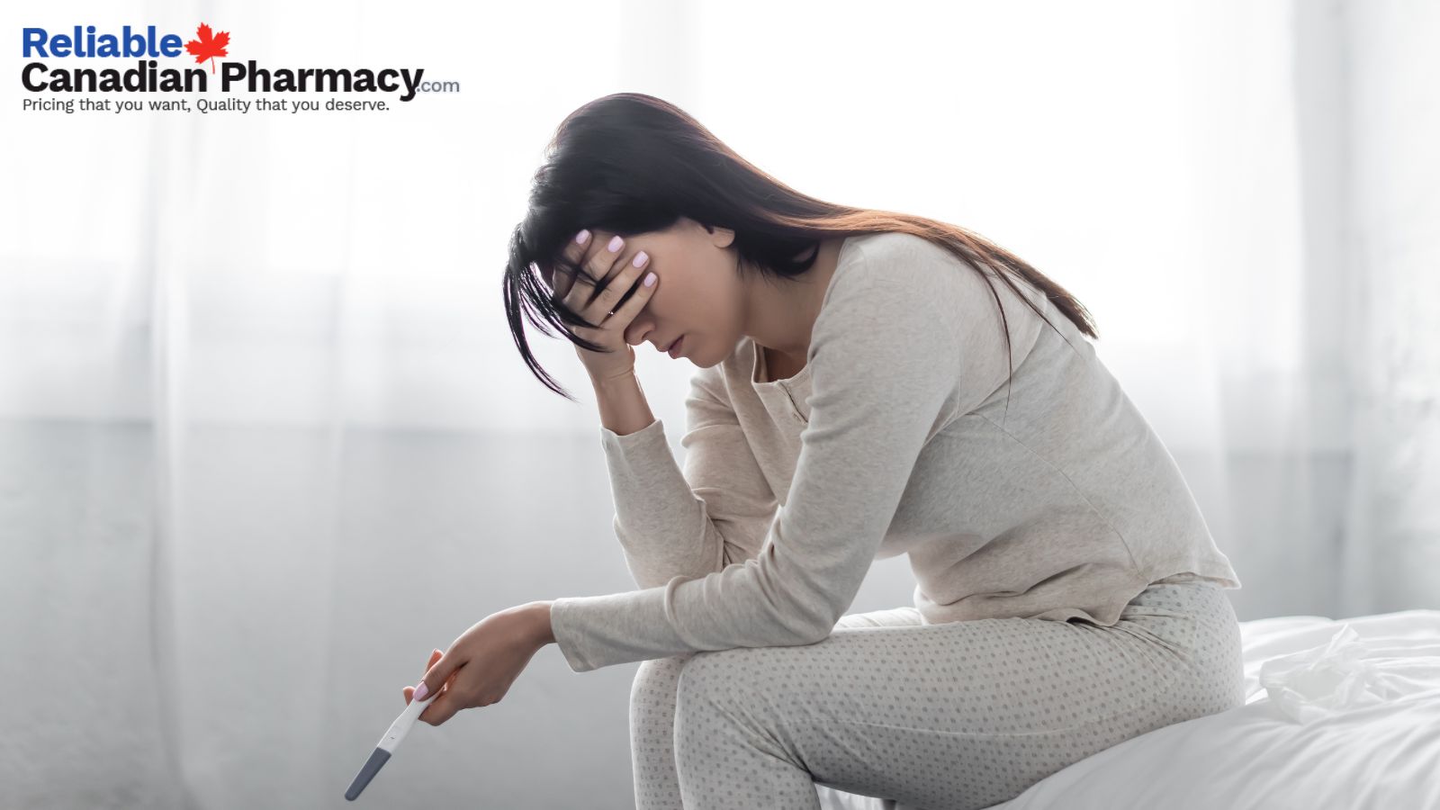 Woman conducting pregnancy test with pregnancy kit.