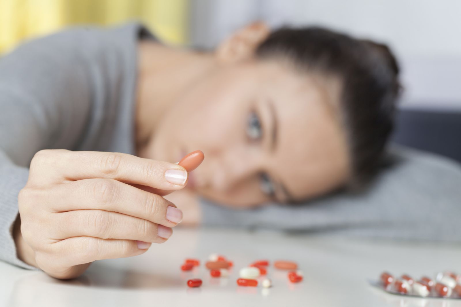girl showing a pill